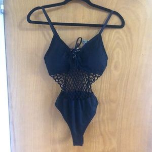 One piece body suit with mesh style stomach color black size medium